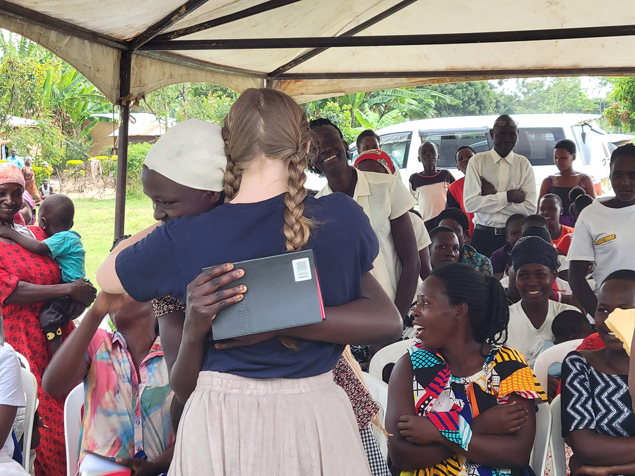 Aubri giving bibles with prayer