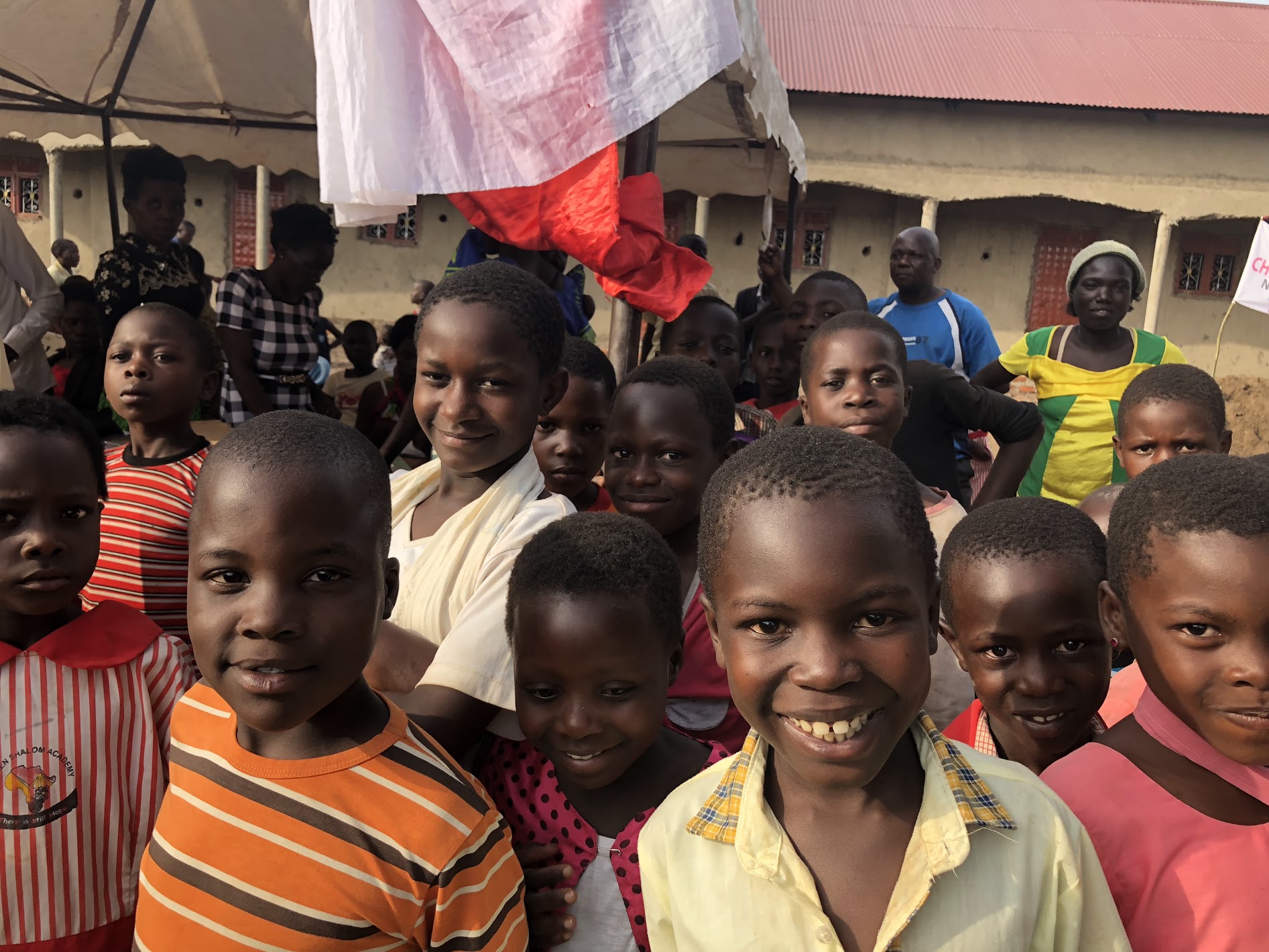 School children in front of our school building, overjoyed to have their picture taken